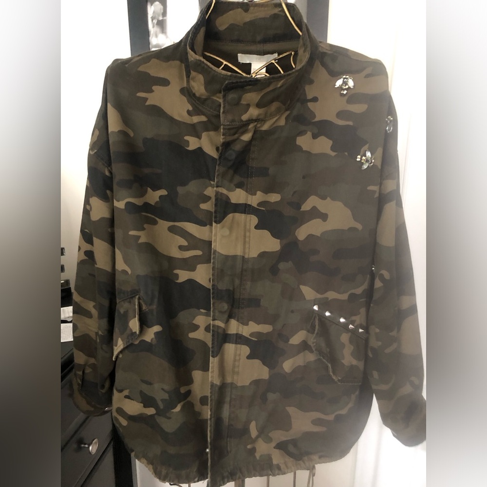 Camouflage long sleeve jacket. Studs along the pocket/shoulder.